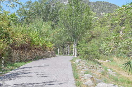 Path to hot springs area of the thermal village of Montanejos, in the region of Castellon (Valencia - Spain). Beautiful mountain environment. Summer time season.