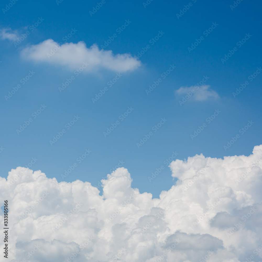 fluffy white cloud above clear blue sky background fluffy white cloud above clear blue sky background