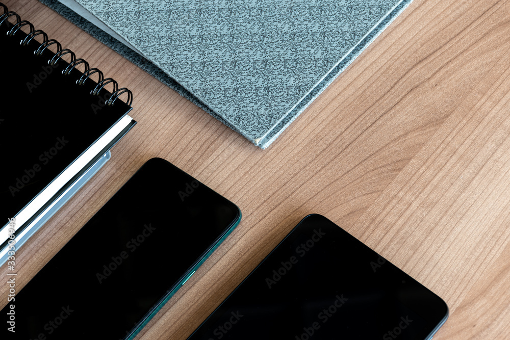 Fototapeta premium Smartphone, notebook, file on table (Business concept)