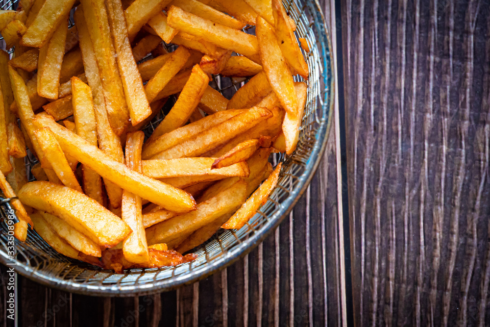 potatoes fries in bowl of grill fryer closeup potatoes fries in bowl of grill fryer closeup
