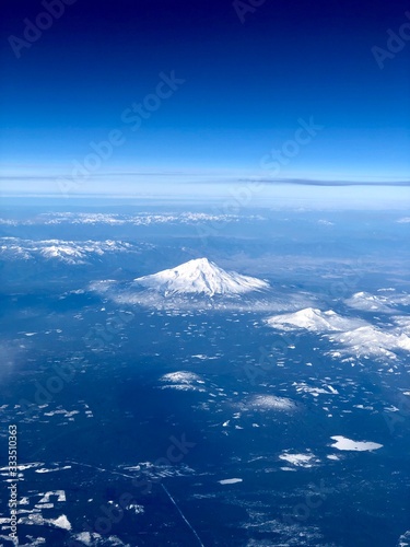 Scenic and beautiful view of Mount Shasta from the window of an airplane