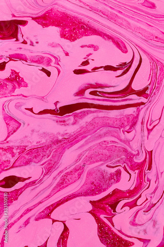 Abstract background of mixed shades of nail polish with a marble