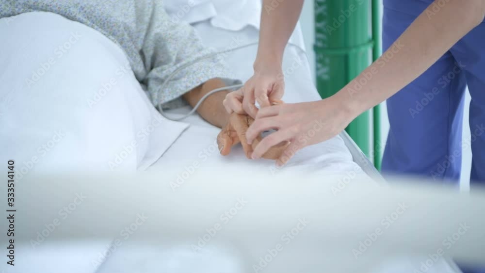 Medical concepts. The nurse is wearing a pulse monitor for the patients in the hospital. 4k Resolution. Medical concepts. The nurse is wearing a pulse monitor for the patients in the hospital. 4k Resolution.