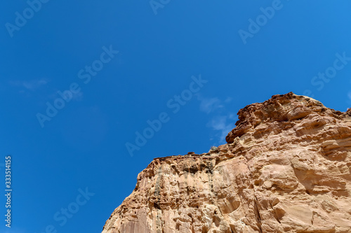 Low angle landscape of steep stone cliffs at Capitol Reef National Park in Utah