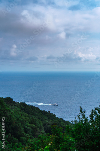 Beautiful scenic view of Mediterranean turquoise sea visible from the hiking Cinque Terre trail from Vernazza to Monterosso al Mare in Italy. 