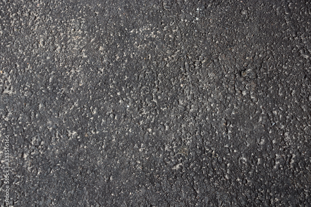 Texture of freshly paved fine sand asphalt in small pits