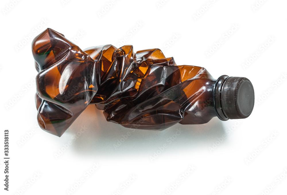 brown crumpled plastic bottle isolated brown crumpled plastic bottle isolated