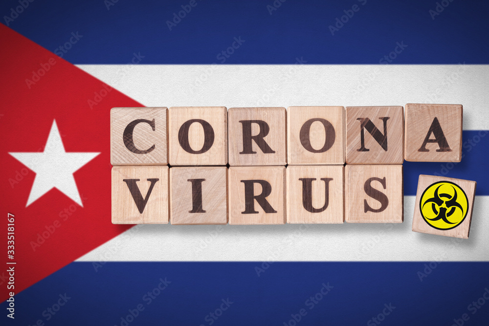 Cuba flag background and wooden blocks with letters spelling CORONAVIRUS and quarantine symbol on it. Novel Coronavirus (2019-nCoV) concept, for an outbreak occurs in Cuba. Cuba flag background and wooden blocks with letters spelling CORONAVIRUS and quarantine symbol on it. Novel Coronavirus (2019-nCoV) concept, for an outbreak occurs in Cuba.