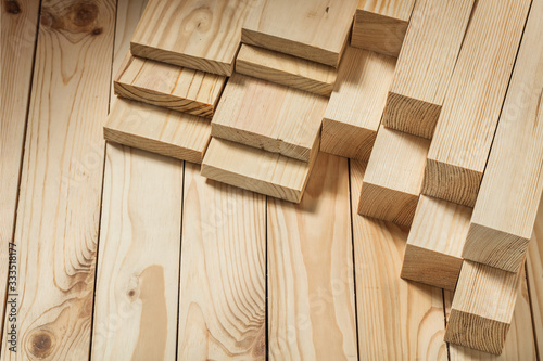 construction concept wooden timber on wood background