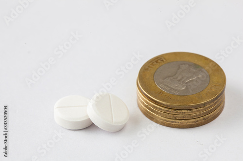 medicine pills with indian coin