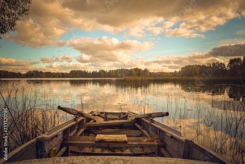 Old fishing boat on the lakeshore. Latvia