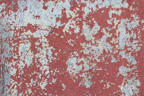Old wooden plywood with peeling red paint. Close-up. Background. Texture. © far700