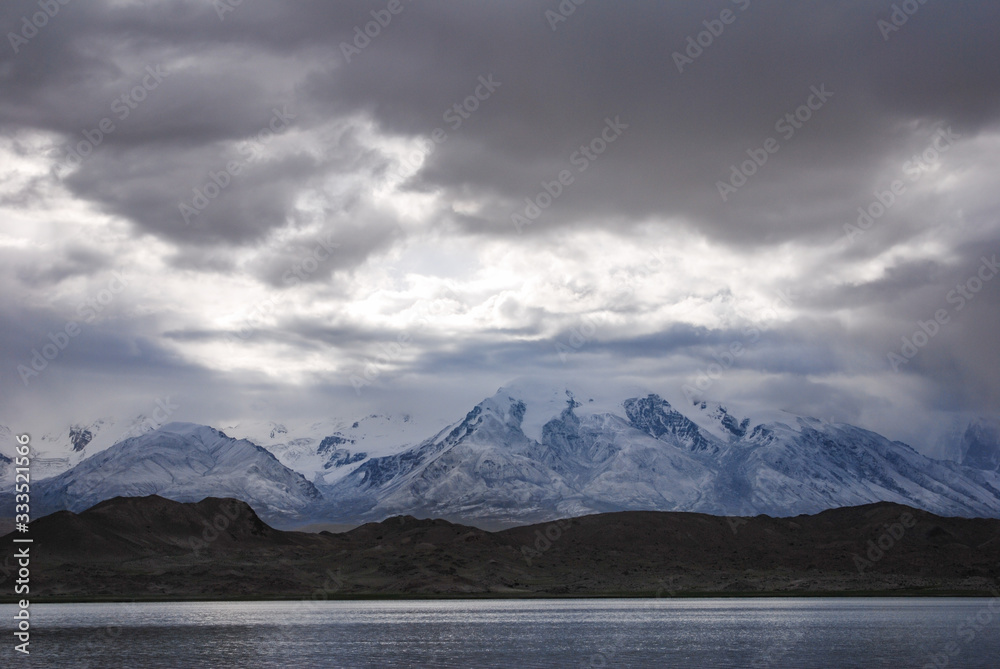 Kala Kule Lake with dramatic sky. Altay Prefecture, Xinjiang, China.
