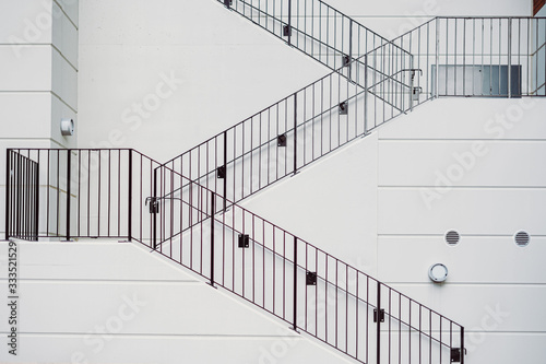 White staircase with black porches. Minimalist architecture  diagonal lines modern construction building