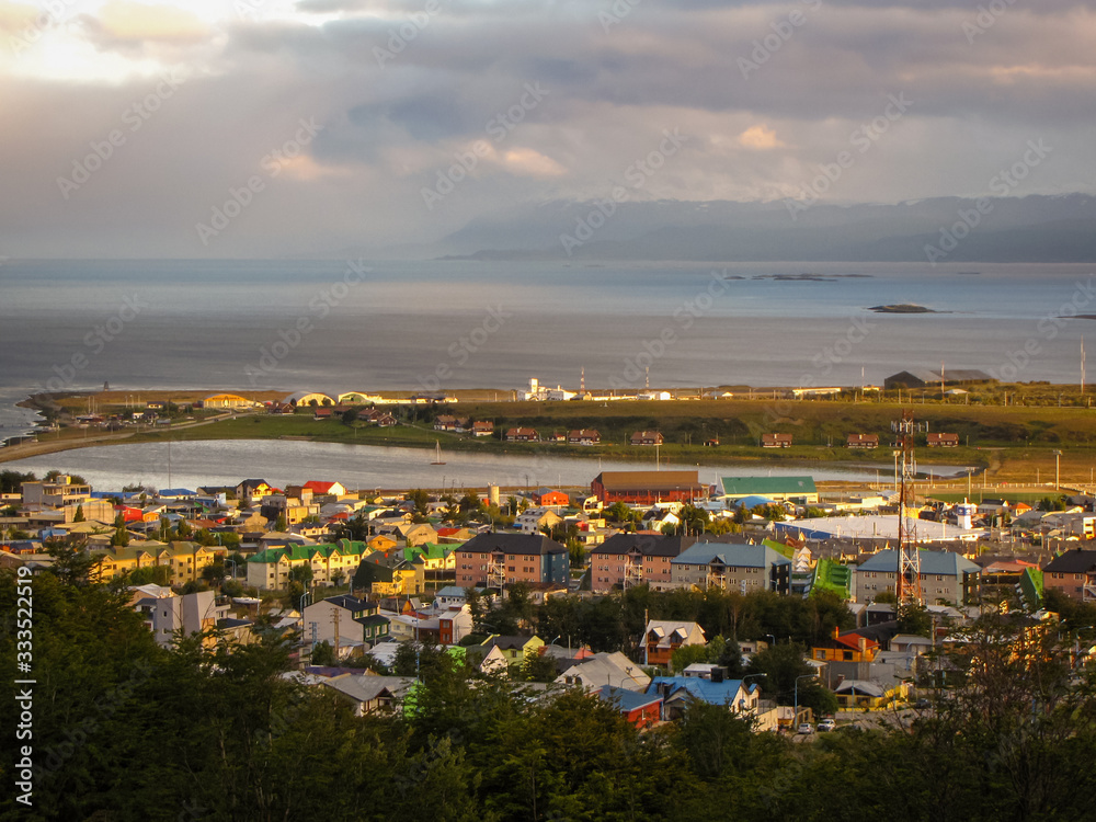 Ushuaia city during golden hour sunset, capital of Tierra del Fuego, nicknamed the End of the World, Argentina, Patagonia, South America