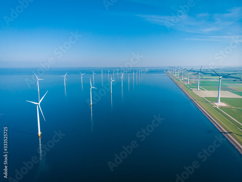 Wind turbine from aerial view, Drone view at windpark westermeerdijk a windmill farm in the lake IJsselmeer the biggest in the Netherlands,Sustainable development, renewable energy photo