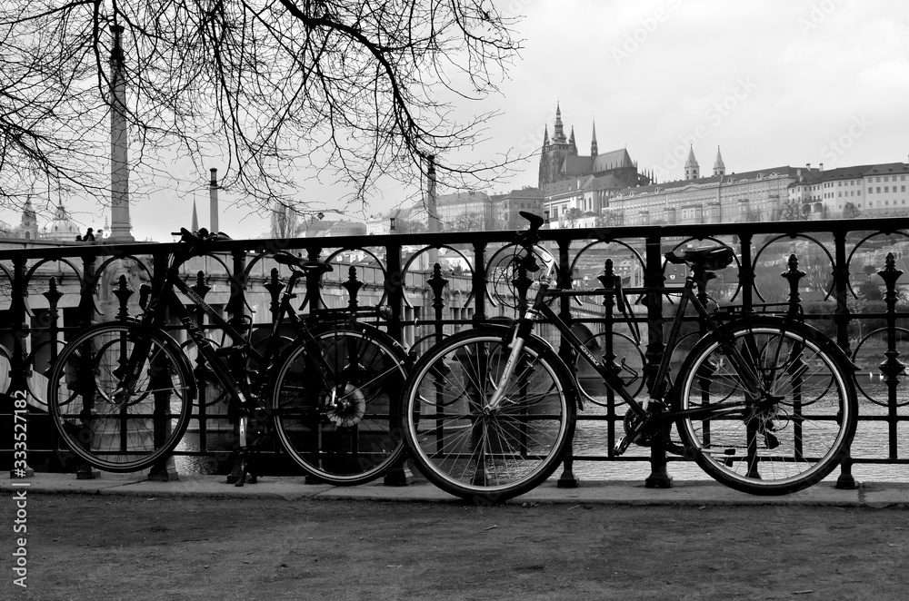 Bicycles on the street with the Prague castle in the background - Czech Republic
