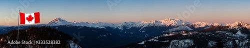 Beautiful Aerial Panoramic View of Canadian Mountain Landscape during a colorful sunset. Taken in Squamish  North of Vancouver  British Columbia  Canada. National Flag Composite