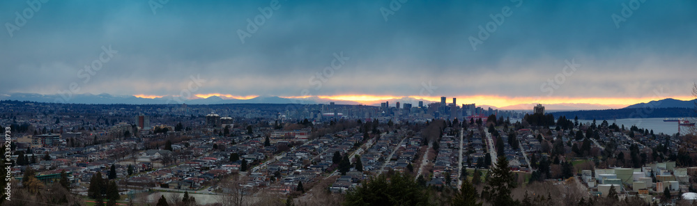Burnaby, Greater Vancouver, British Columbia, Canada . Beautiful Aerial Panoramic View of the city from the top of the hill during a colorful winter sunset.