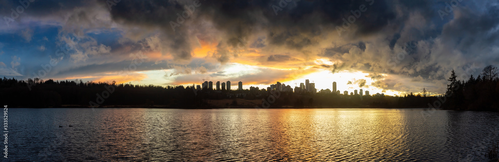 Burnaby, Greater Vancouver, British Columbia, Canada. Beautiful Panoramic View of Deer Lake during a colorful and vibrant winter sunset with Metrotown Buildings in the Background. Panorama HDR