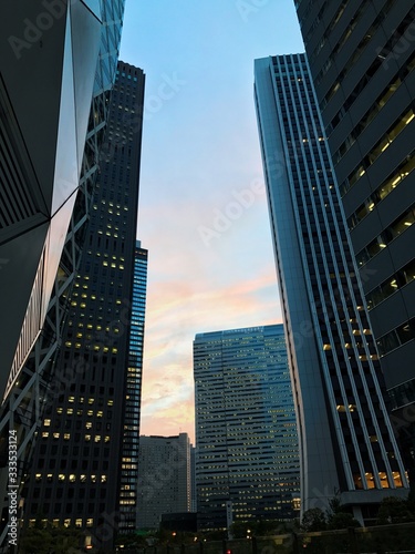 modern business building with sunset, amazing view, beautiful scenery, cool landscape, sky tower in big city at evening, tokyo mode gakuen in nice weather
