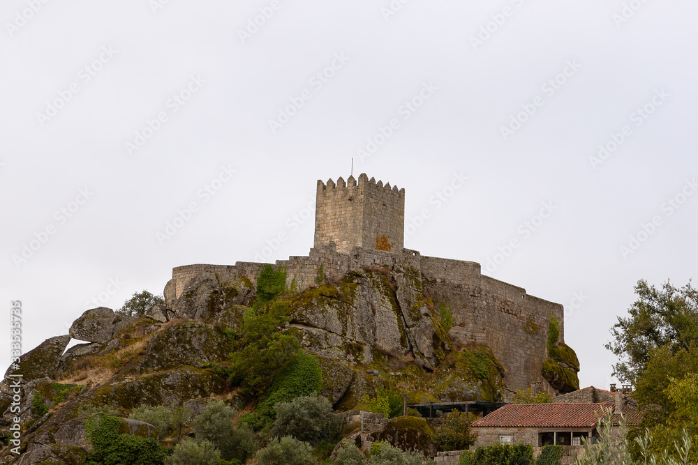 Medieval castle of the historic village of Sortelha on a very cloudy day. Sortelha is one of historic villages of Portugal, located in Guarda district