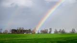 Part of a rainbow after the rain over the Normandy countryside in winter