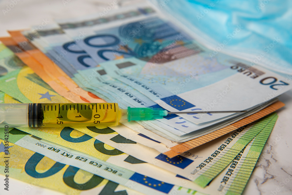 cost of coronavirus breakdown in europe Euro banknotes and vaccine
