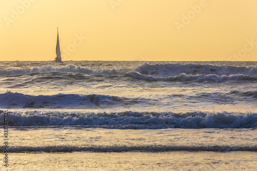 Sailboats sailing in a stor...