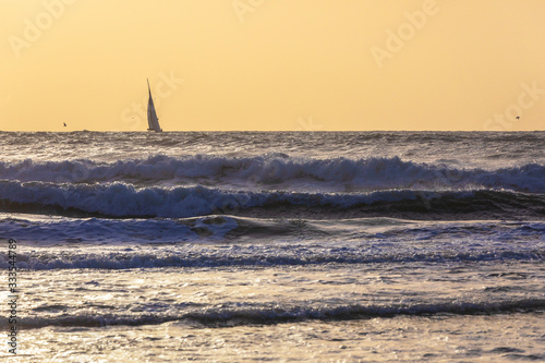 Sailboats sailing in a stor...