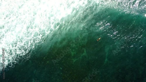 Wallpaper Mural Aerial footage of one surfer by another catching the waves. Crushing waves, deep green waters. Philippines. Torontodigital.ca
