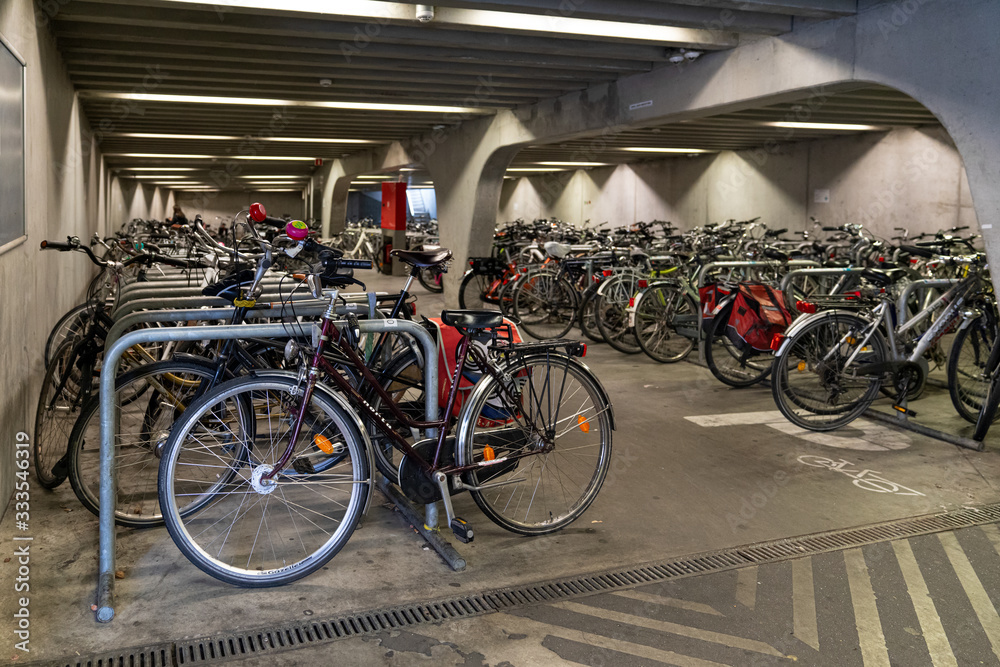 Ghent/Belgium - October 10, 2019:Bicycle parking under the bridge in the heart of Ghent, Belgium