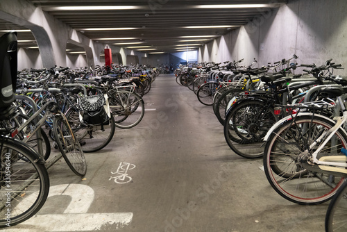 Ghent/Belgium - October 10, 2019:Bicycle parking under the bridge in the heart of Ghent, Belgium