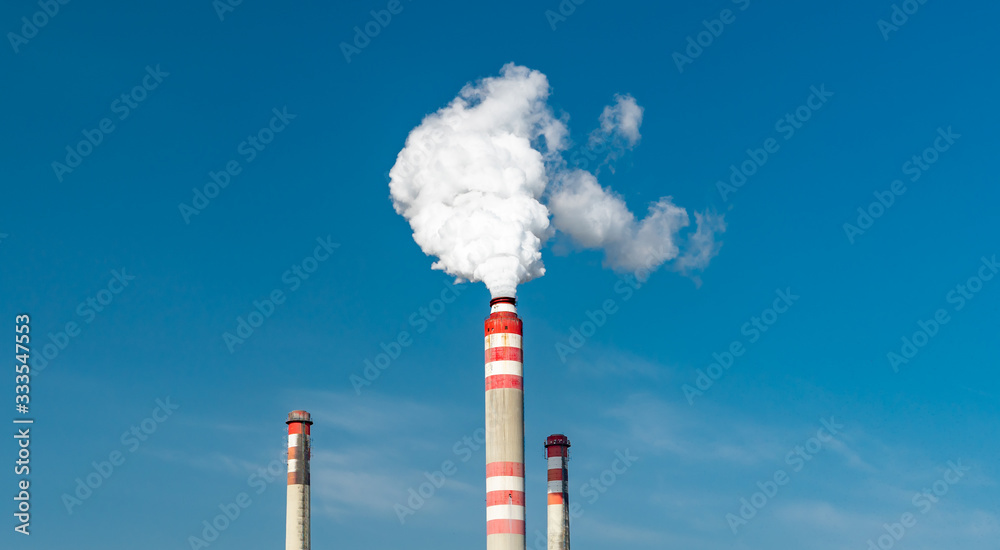 power plant chimney producing the smoke