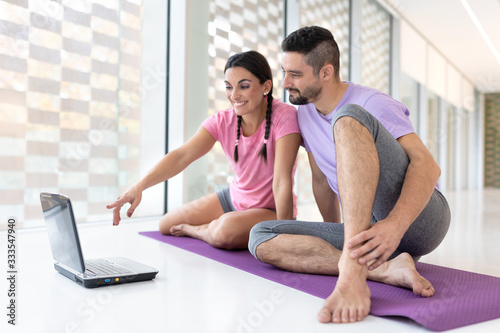 healthy boy and girl couple doing sport indoors bright and white