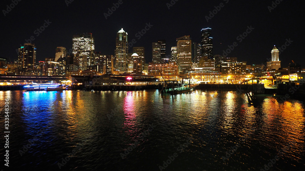 Seattle, Washington - February 10, 2018 - Skyline of city of Seattle from Seattle - Bainbridge Island ferry at night.