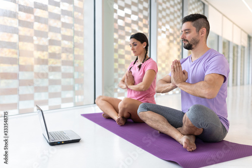 healthy boy and girl couple doing sport indoors bright and white