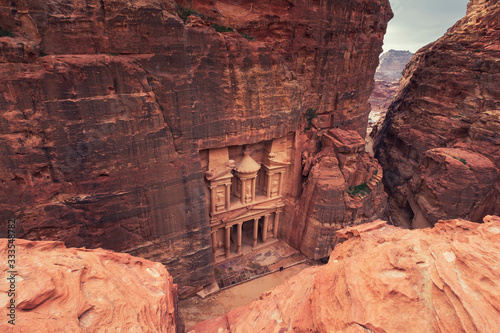 Top view of Al Khazneh - rock cut temple, the treasury in ancient Nabatean city of Petra, Jordan.