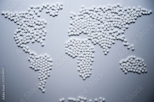 World health map concept created from white tablets urgently needed to cure the whole world from viruses and infections that threatening whole population