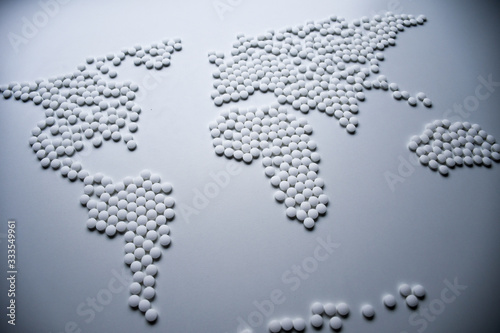 World health map concept created from white tablets urgently needed to cure the whole world from viruses and infections that threatening whole population