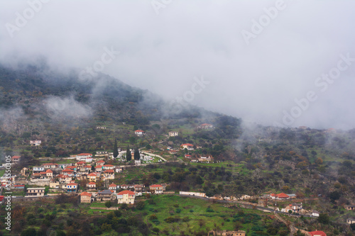 Image of village in the mountains with fog, Arcadia, Greece