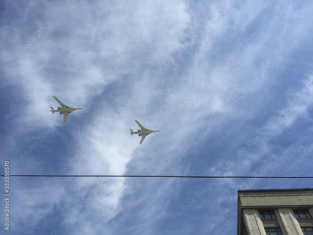 during military parade in Moscow military planes fly in formation in the blue sky during military parade in Moscow military planes fly in formation in the blue sky