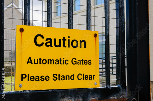 Sign at a heavily fortified PSNI police station "Caution: automatic gates. Please stand clear"
