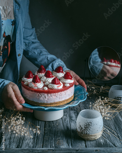 Strawberry mousse cake on a wooden table