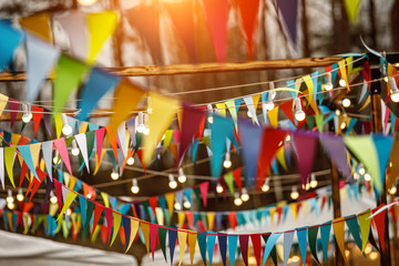 Background from holiday flags. Many colored flags and lanterns