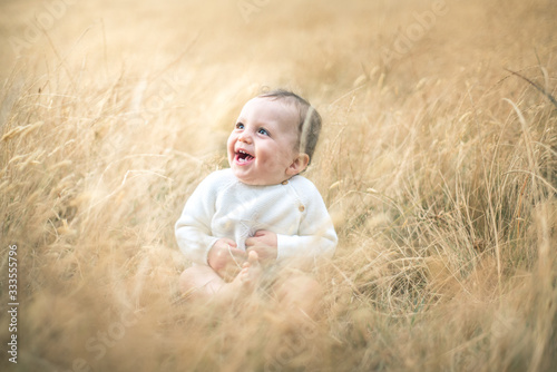 baby in a wheat filed 