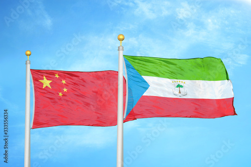 Wallpaper Mural China and Equatorial Guinea two flags on flagpoles and blue cloudy sky Torontodigital.ca