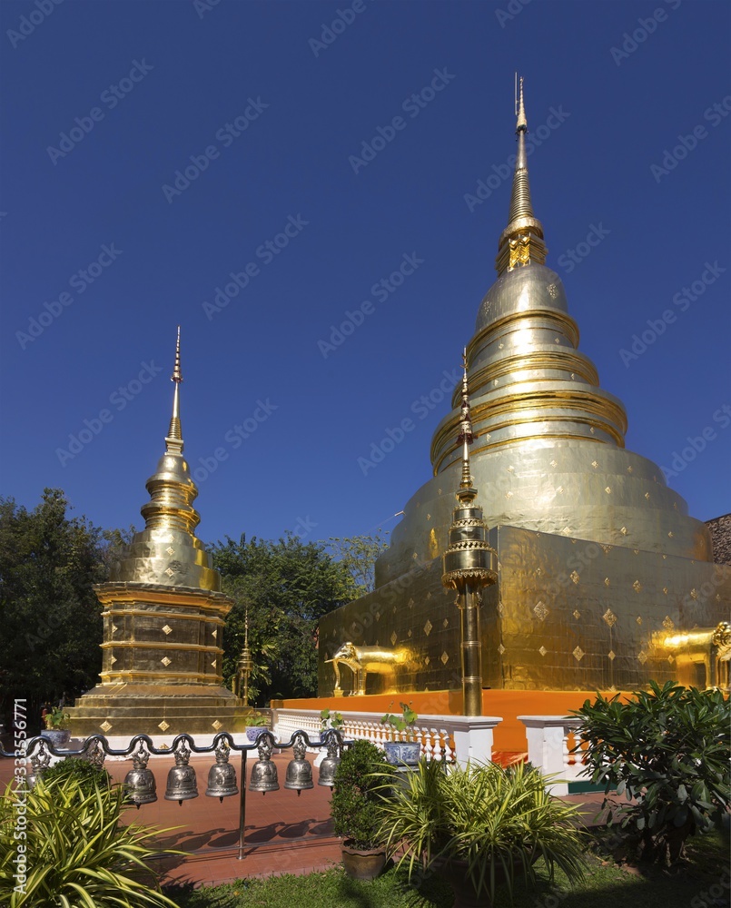 Naklejka premium Giant Buddhist Chedi Stupa Monuments at Wat Pra Singh Golden Temple Complex in Chiang Mai, Thailand
