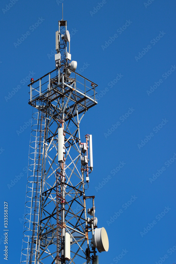 Telecommunication tower against blue sky Telecommunication tower against blue sky