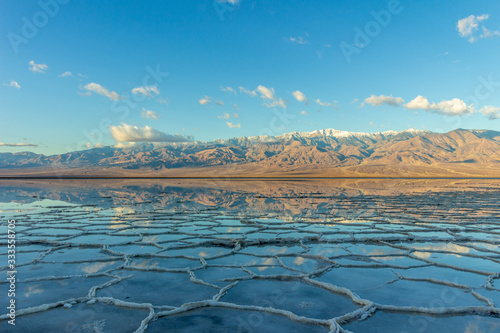 Badwater Basin and Telescope Peak. Salt Crust and Clouds Reflection. Death Valley National Park. California USA photo